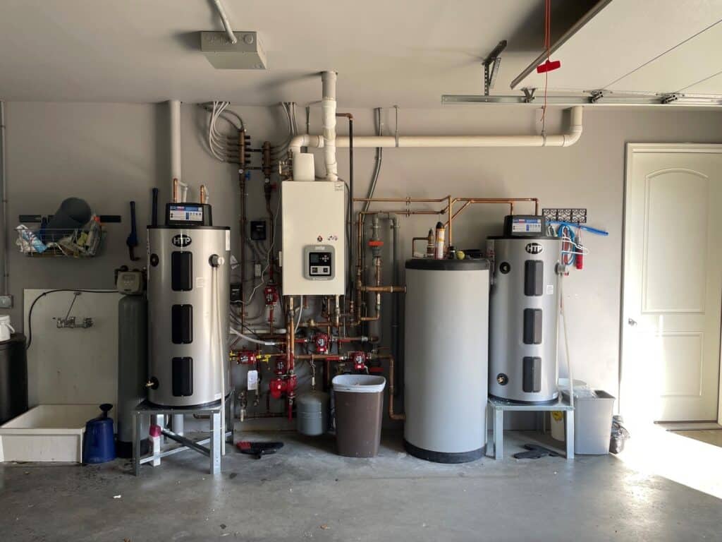 Modern plumbing installations in a residential garage setting.