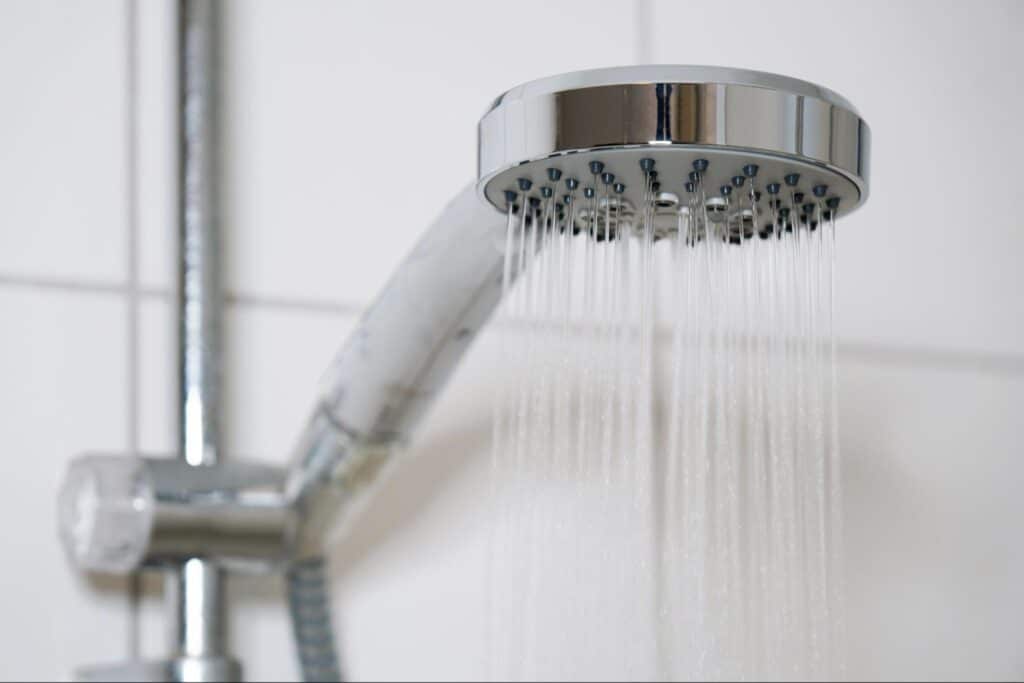 Modern chrome shower head for a soothing and refreshing bathing experience.
