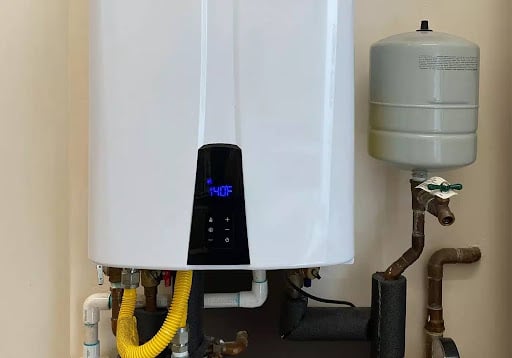 Modern water heater installation featuring digital controls and efficient piping system.