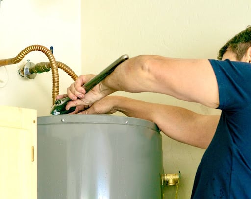 Professional water heater repair by an expert technician in action.