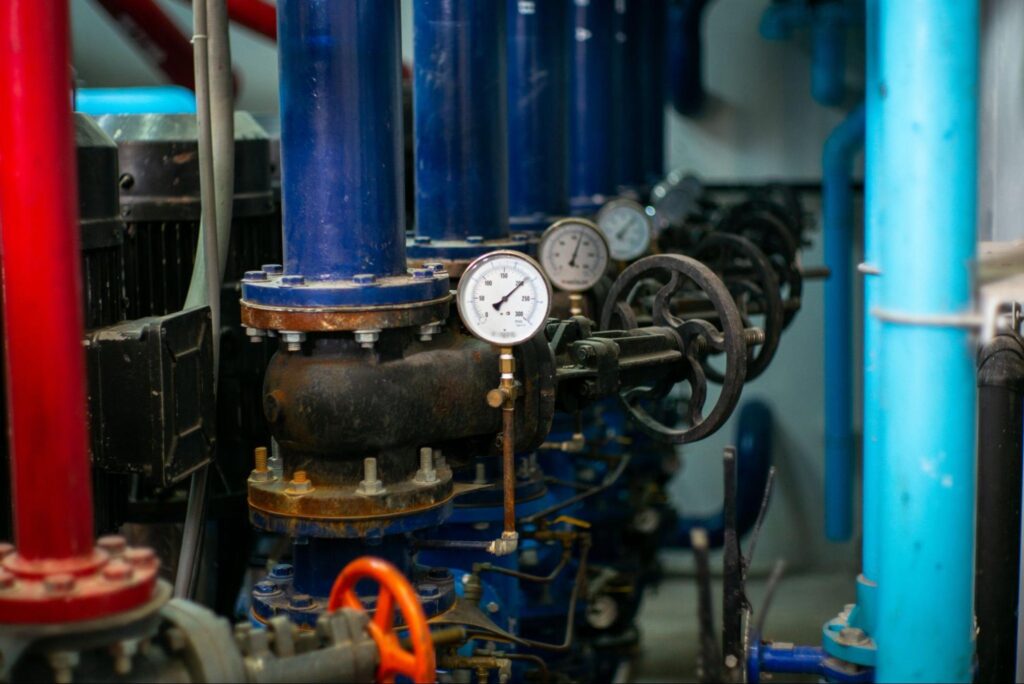Industrial pipes and gauges in a mechanical setup for efficient fluid control.