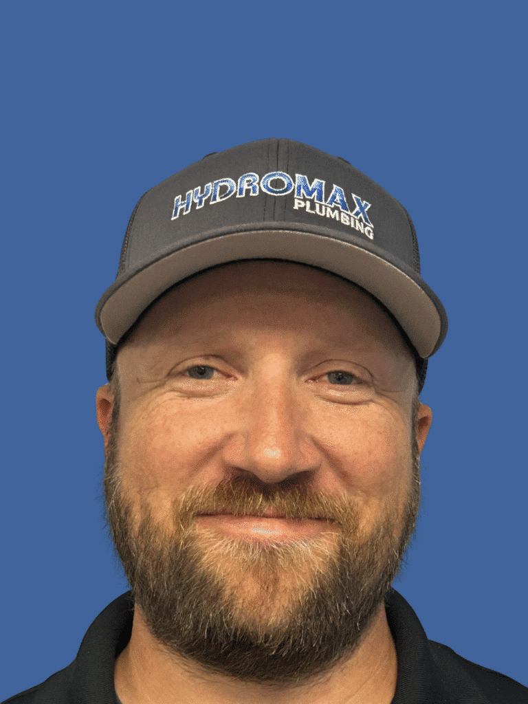 Professional plumber from Hydromax Plumbing, showcasing expertise and friendly service.