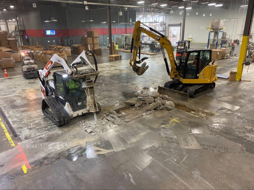 Cured-In-Place Pipe Installation in a warehouse floor renovation project.